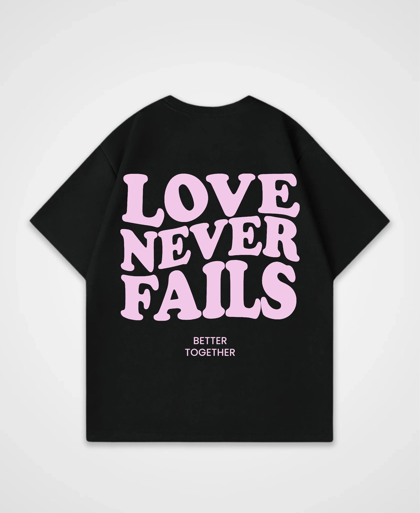 LOVE NEVER FAILS OVERSIZED SHIRT