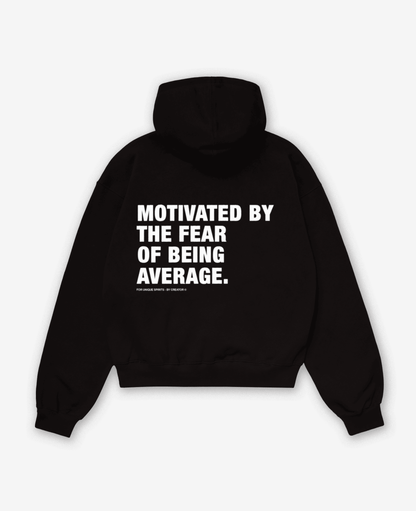 MOTIVATED BY THE FEAR OF BEING AVERAGE OVERSIZED UNISEX HOODIE