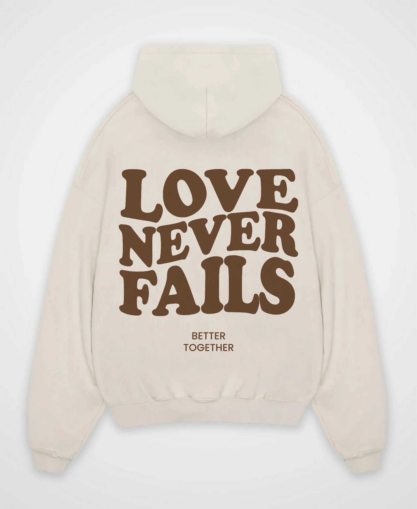 LOVE NEVER FAILS OVERSIZED HOODIE