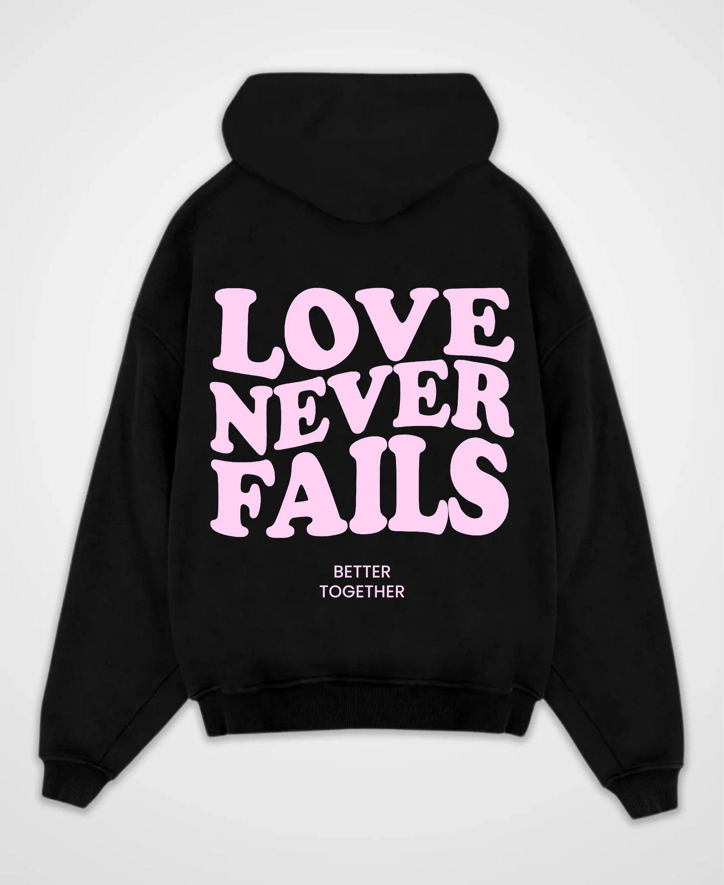 LOVE NEVER FAILS OVERSIZED HOODIE