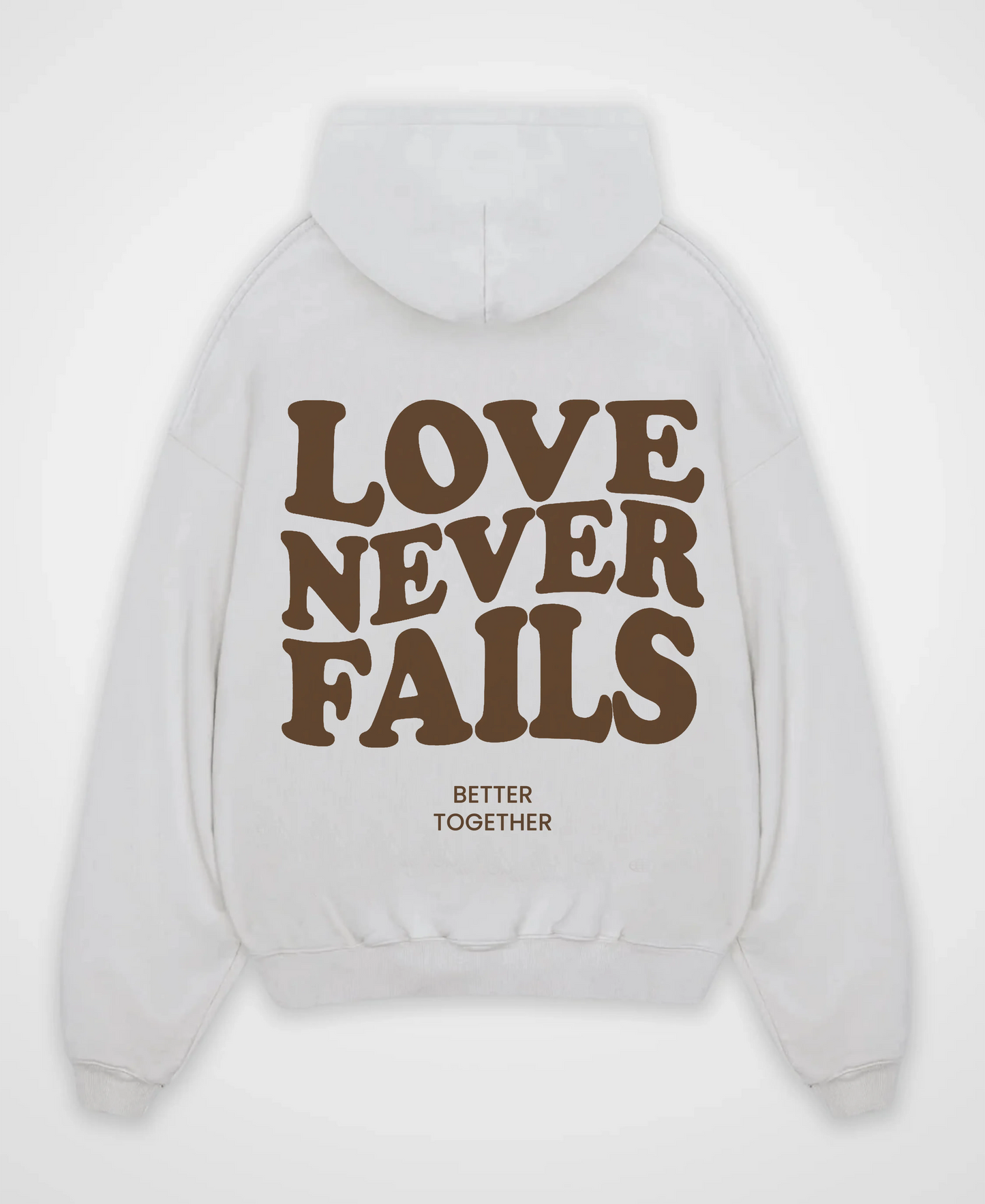 LOVE NEVER FAILS OVERSIZED HOODIE
