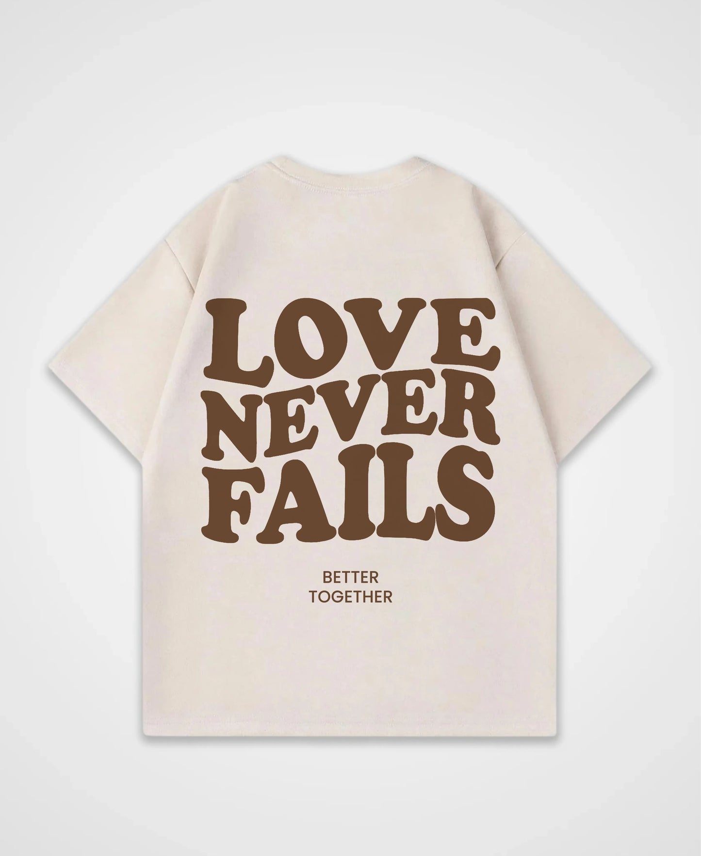 LOVE NEVER FAILS OVERSIZED SHIRT