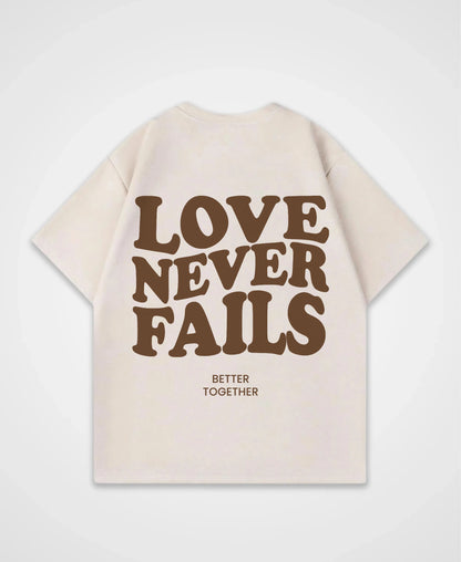 LOVE NEVER FAILS OVERSIZED SHIRT