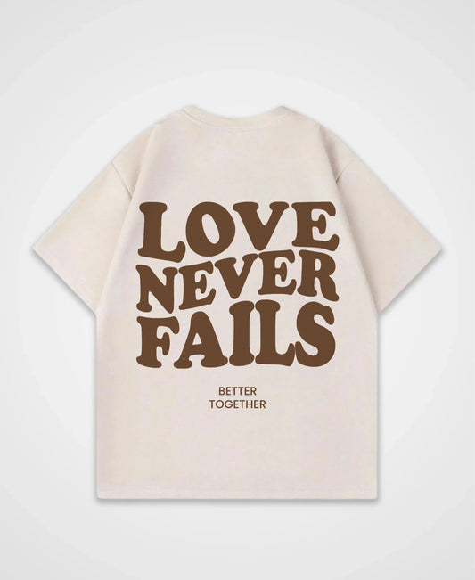 LOVE NEVER FAILS OVERSIZED SHIRT