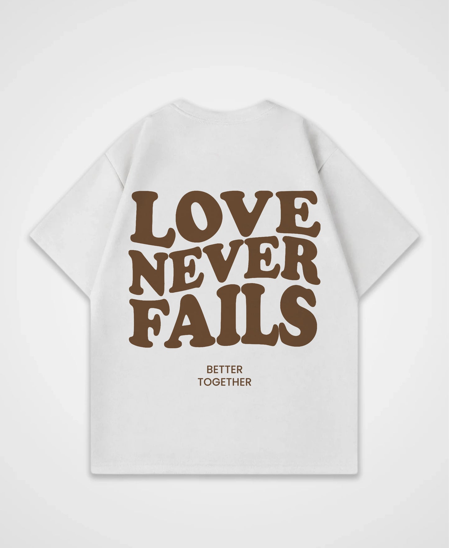 LOVE NEVER FAILS OVERSIZED SHIRT