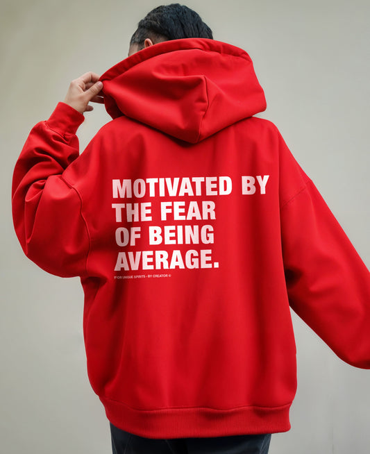 MOTIVATED BY THE FEAR OF BEING AVERAGE OVERSIZED UNISEX HOODIE